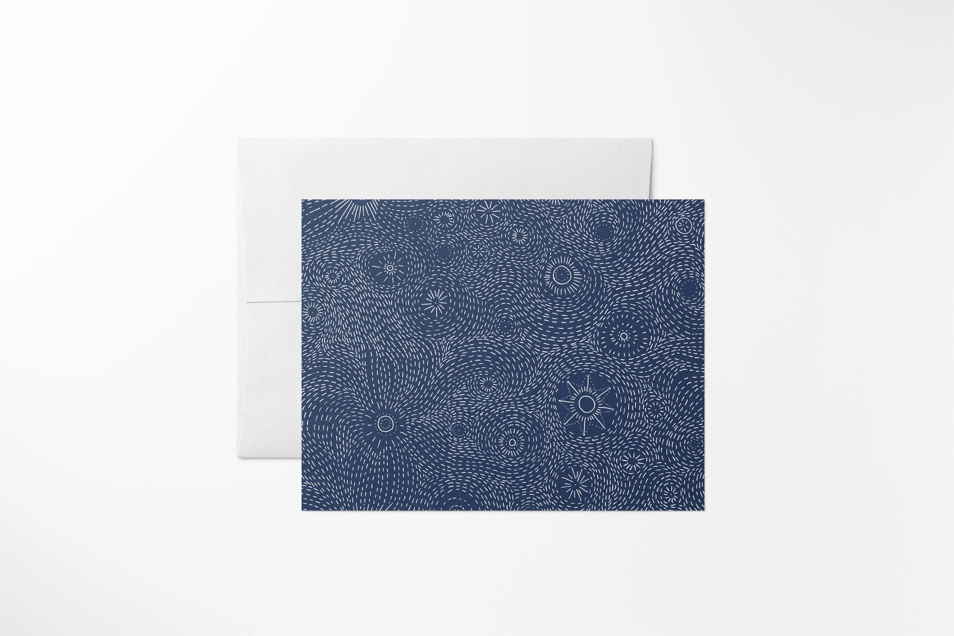 Blank notecard with a hand-drawn navy blue starry night cover on recycled, uncoated paper. With a matching white envelope.
