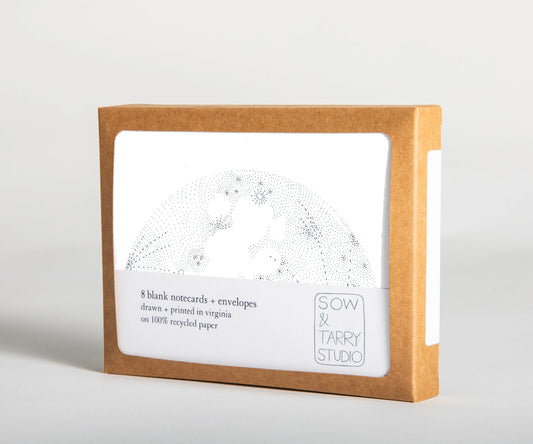 A boxed set of blank notecards, printed with a hand-drawn illustration of a moon on white, uncoated recycled paper. Packaged in a compostable box.