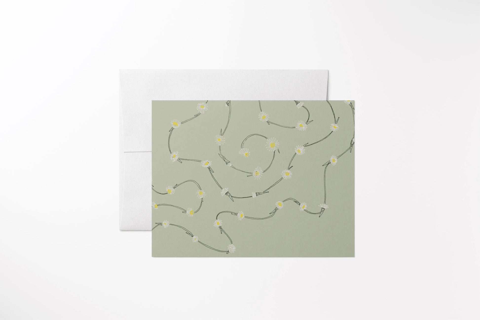 Blank notecard with a hand-drawn multi-colored daisy chain. Printed on 100% recycled, uncoated paper, green, with a matching white envelope.